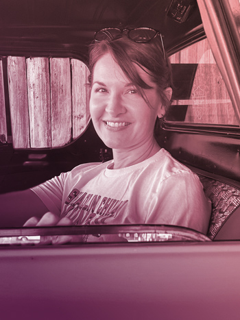 jami sitting in an old truck